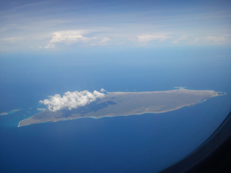 La Tortuga seen from an aircraft, long and flat in a blue sea