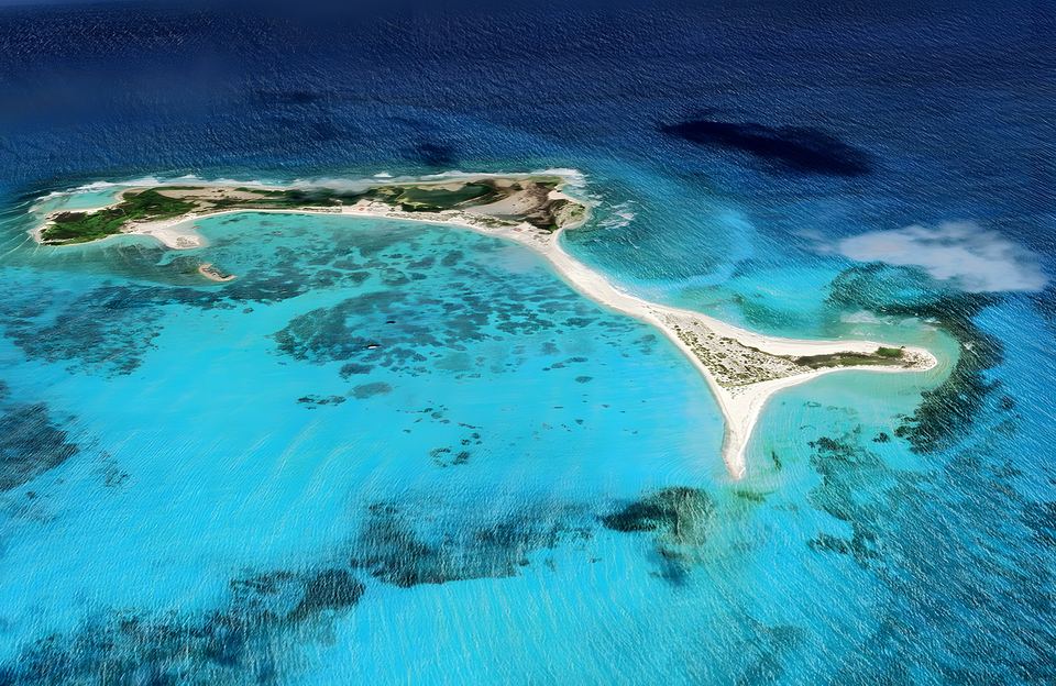 Aerial view of Cayo Herradura over turquoise water