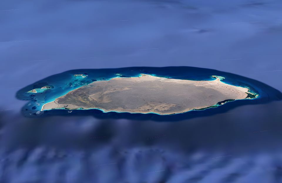 Oblique view of La Tortuga, a long low island in the Caribbean